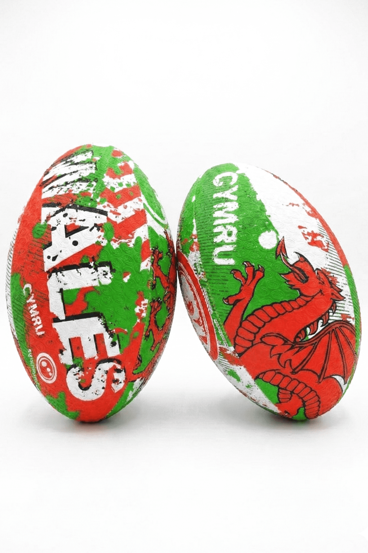 Two green, red and white Optimum Wales rugby balls with WALES CYMRU print and red dragon on white - Optimum
