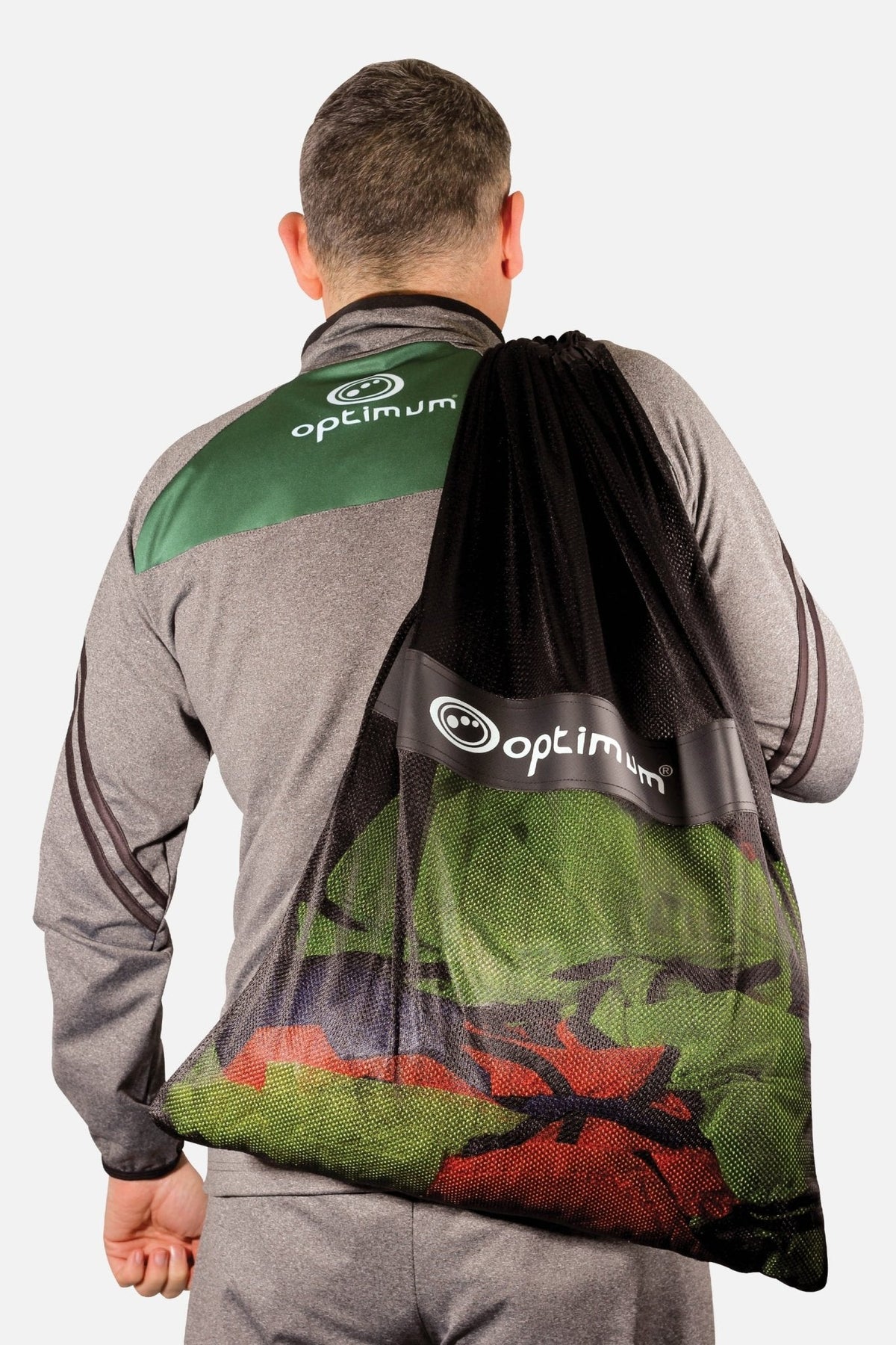 Black mesh Optimum bib bag carried over the shoulder, filled with green and red bibs, white logo - Optimum