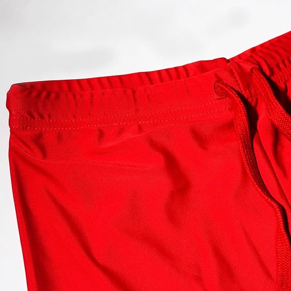 Close-up of red Optimum Multi-X shorts elasticated waistband corner, on white - Optimum