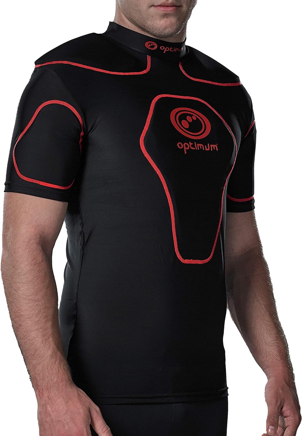 Black Optimum Origin rugby protective top with red trim and shoulder padding, worn three-quarter view - Optimum